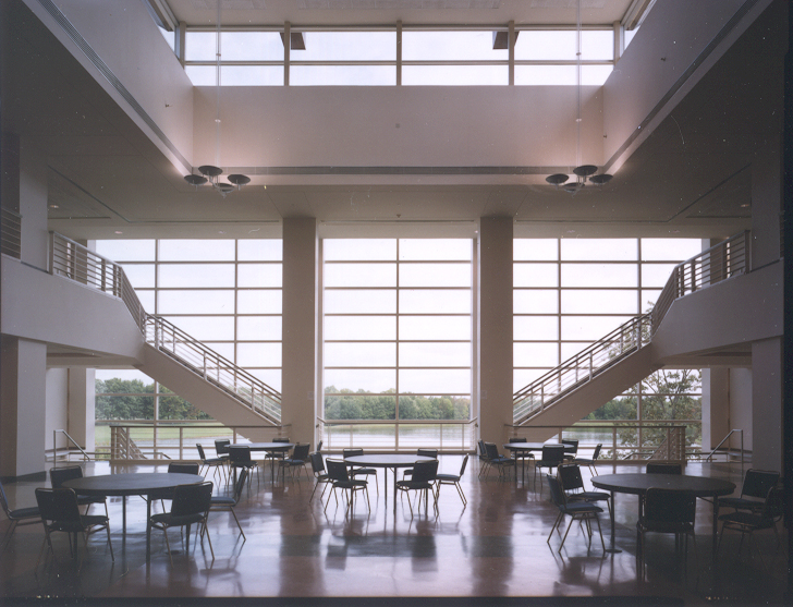 Foundation Lobby with 5 round tables looking through the ceiling high windows